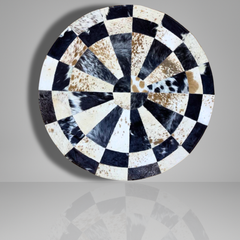 Handmade Sunburst Round Cowhide Rug crafted from natural hair-on hide panels. Radial patchwork design, 9 sq ft. Luxurious, unique, and artisan-stitched for modern & rustic interiors.