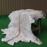 Rustic Brown and White Goat Skin Rug - Unique Pattern for Modern and Classic Décor