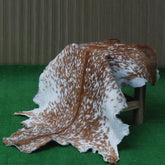 Handcrafted Brown and White Goat Skin Rug - Soft, Durable, and Elegant Décor