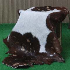 Decorative Brown and White Goat Hide Rug - Perfect for Floor or Wall Accents