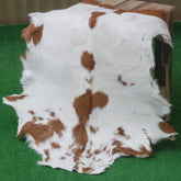 Decorative Brown and White Goat Hide Rug - Perfect for Floor or Wall Accents