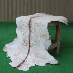 Handcrafted Brown and White Goat Skin Rug - Soft, Durable, and Elegant Décor