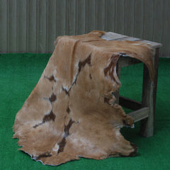 Luxurious Brown and White Goat Hide Rug - Natural Hair-On Leather for Home Styling