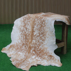 Natural Brown and White Goat Hide Rug - Luxurious Accent for Modern Homes