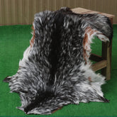 Rustic Black and White Goat Hide Rug - Perfect for Floor or Wall Décor
