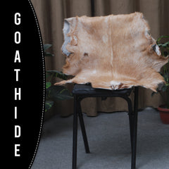 Elegant Brown and White Goat Hide Rug - Perfect Accent for Living Room or Bedroom