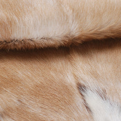 Elegant Brown and White Goat Hide Rug - Perfect Accent for Living Room or Bedroom