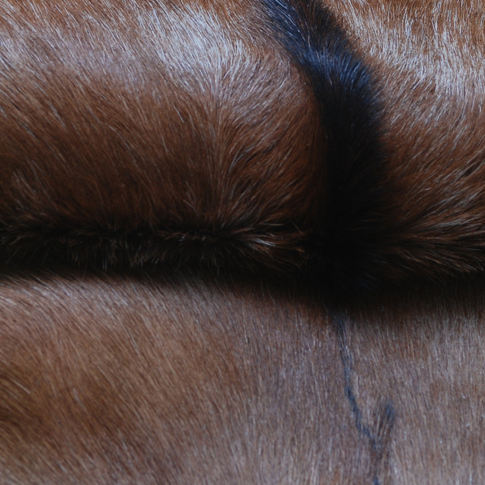 Luxurious Brown and Black Goat Hide Rug with Unique Patterns and Non-Slip Suede Back - Sustainable Eco-Friendly Accent Piece - Celestial Leather Limited