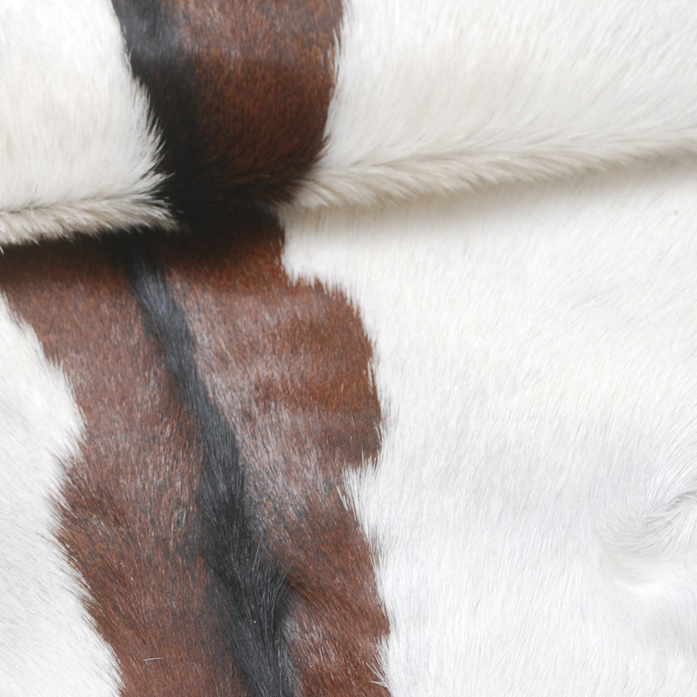 Luxury Handmade Dark Brown White Goat Skin Rug with Non-Slip Suede Backing - Eco-Friendly Natural Beauty for High-Traffic Areas - Celestial Leather Limited