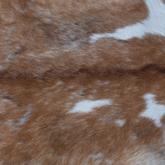 Elegant Brown and White Goat Hide Rug - Perfect Accent for Living Room or Bedroom