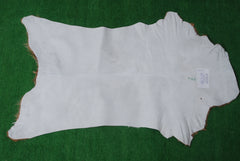 Elegant Brown and White Goat Hide Rug - Perfect Accent for Living Room or Bedroom