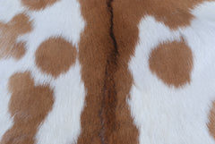 Decorative Brown and White Goat Hide Rug - Perfect for Floor or Wall Accents