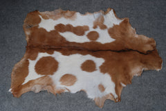 Decorative Brown and White Goat Hide Rug - Perfect for Floor or Wall Accents