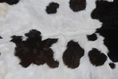 Rustic Black and White Goat Hide Rug - Perfect for Floor or Wall Décor