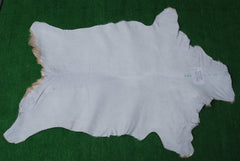 Natural Brown and White Goat Hide Rug - Luxurious Accent for Modern Homes