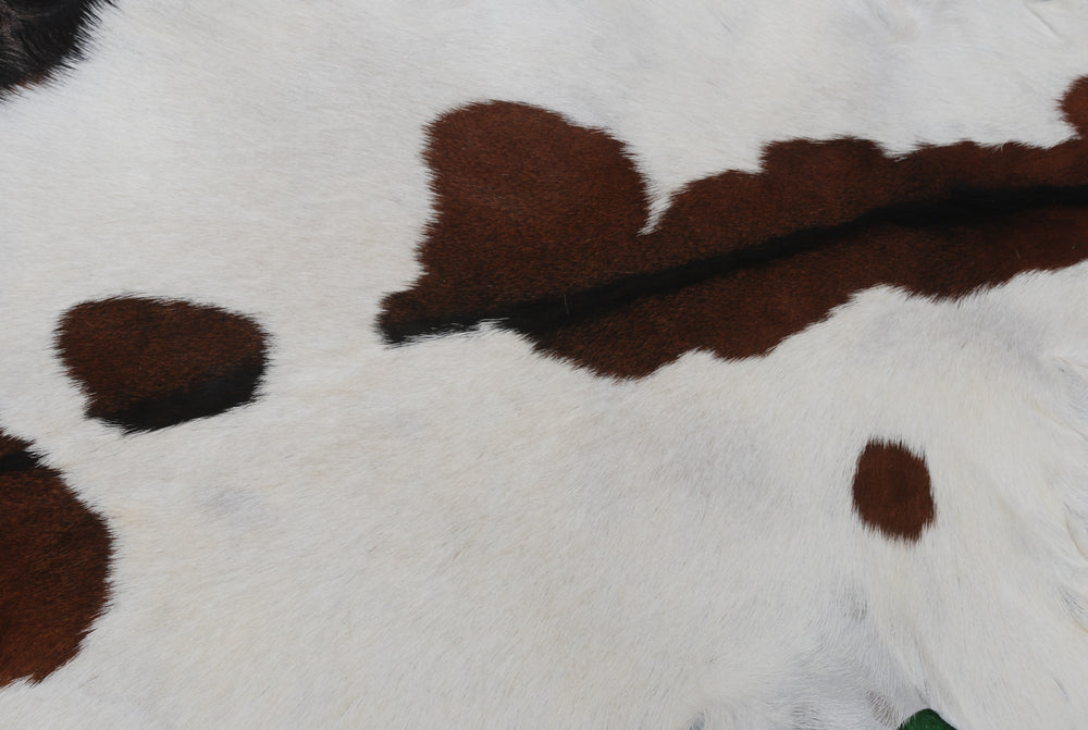 Luxury Handmade Dark Brown White Goat Skin Rug with Non-Slip Suede Backing - Eco-Friendly Natural Beauty for High-Traffic Areas - Celestial Leather Limited