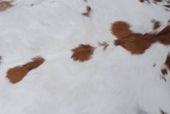 Decorative Brown and White Goat Hide Rug - Perfect for Floor or Wall Accents