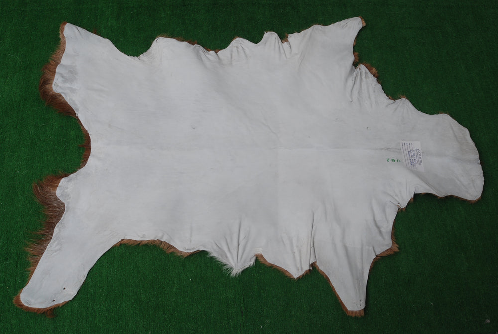 Luxurious Brown and Black Goat Skin Rug - Sustainable Hair-on Goat Hide Rug for Home Décor - Celestial Leather Limited