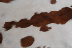 Luxurious Brown & White Genuine Goat Skin Rug for Home Décor - Celestial Leather Limited