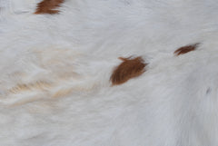 Luxury Brown and White Goat Hide Rug | Premium Hair-On Skin | Non-Slip Suede Back | Sustainable & Eco-Friendly | Handcrafted Elegance