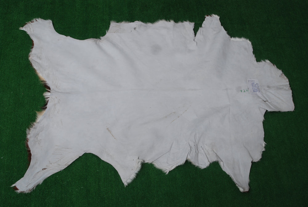 Luxurious Brown and White Goat Skin Rug - Premium Hair-On Eco-Friendly Goatskin Rug with Unique Patterns and Non-Slip Suede Back - Celestial Leather Limited