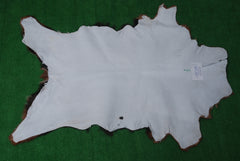 Luxurious Brown and Black Goat Hide Rug with Unique Patterns and Non-Slip Suede Back - Sustainable Eco-Friendly Accent Piece - Celestial Leather Limited