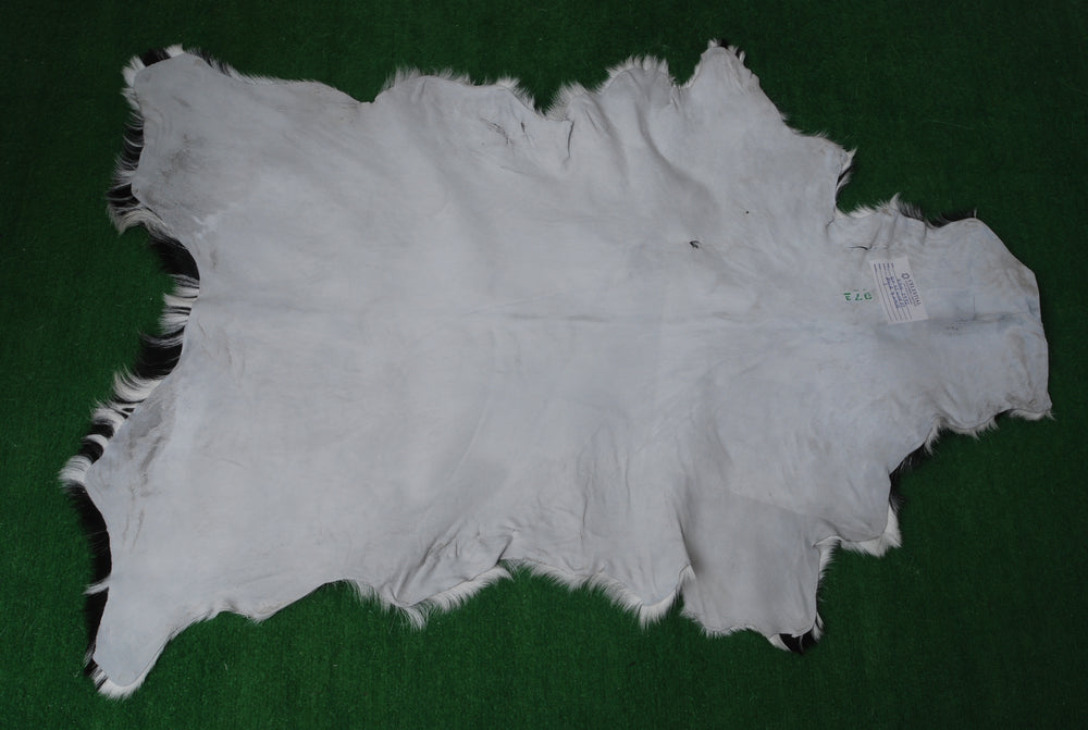 Unique Natural Black & White Goat Skin Rug - Sustainable Animal Hide Throw Floor Rug - Modern Eco-Friendly Home Décor Rug - Celestial Leather Limited