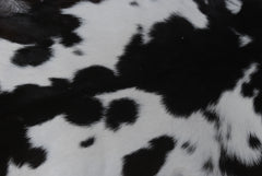 Elegant Black and White Goat Hide Rug - Perfect Accent for Any Room