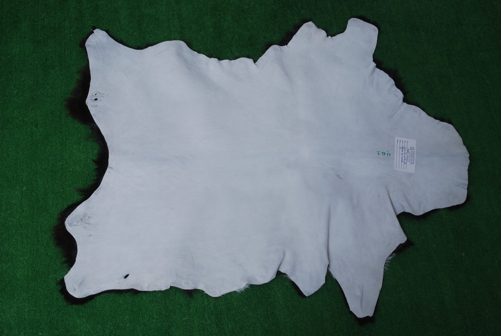 Luxury Black & White Goat Skin Rug with Non-Slip Backing - Hypoallergenic, Non-Shedding & Durable - Handmade Eco-Friendly Floor Rug - Celestial Leather Limited