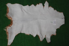 Elegant Brown and White Goat Hide Rug - Perfect Accent for Living Room or Bedroom