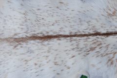 Handcrafted Brown and White Goat Skin Rug - Soft, Durable, and Elegant Décor