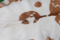 Rustic Brown and White Goat Skin Rug - Unique Pattern for Modern and Classic Décor