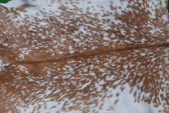 Handcrafted Brown and White Goat Skin Rug - Soft, Durable, and Elegant Décor