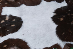 Decorative Brown and White Goat Hide Rug - Perfect for Floor or Wall Accents