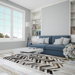 Luxurious Handmade Cowhide Patchwork Area Rug with Zig Zag Stitching - Unique & Practical Home Decor Accent