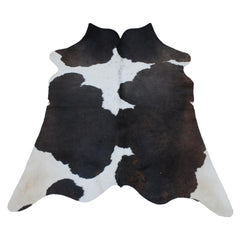 Luxury Medium Cowhide Rug Handcrafted from Natural Dark Brown & White Hair - Durable, Hypoallergenic, and Versatile Addition to Any Space