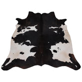 Luxury Handcrafted Medium Brown and White Cowhide Rug - Hypoallergenic, Non-Slip Backing, One-of-a-Kind Natural Beauty