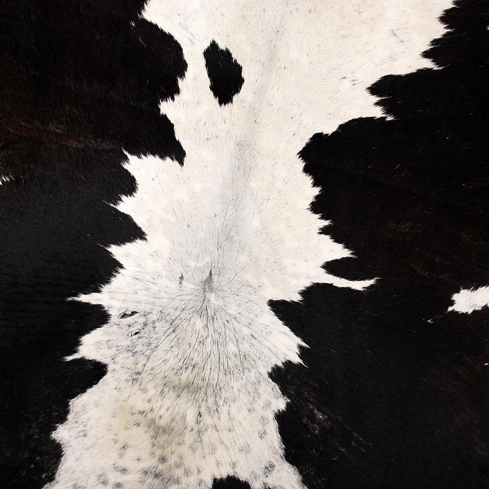 Luxurious Large Black & White Cowhide Rug with Natural Hair for Stylish Home Decor - Allergen-Free Living - Celestial Leather Limited