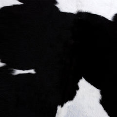 Stunning Black & White Cowhide Rug with Animal Print Design | Luxurious - Durable Accent for Home Decor - Celestial Leather Limited