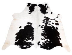 Luxury Handcrafted Cowhide Rug in Bold Black and White - Stunning Home Décor Accent with Hypoallergenic Properties