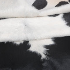 Luxurious Dark Brown & White Cowhide Rug - Medium Size for Modern Home Decor