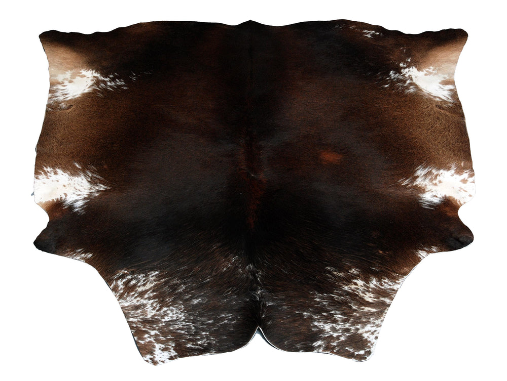 Luxurious Dark Brown and White Cowhide Rug for Sophisticated Lounge Decor - Celestial Leather Limited