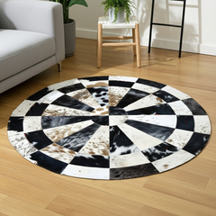 Handmade Sunburst Round Cowhide Rug crafted from natural hair-on hide panels. Radial patchwork design, 9 sq ft. Luxurious, unique, and artisan-stitched for modern & rustic interiors.