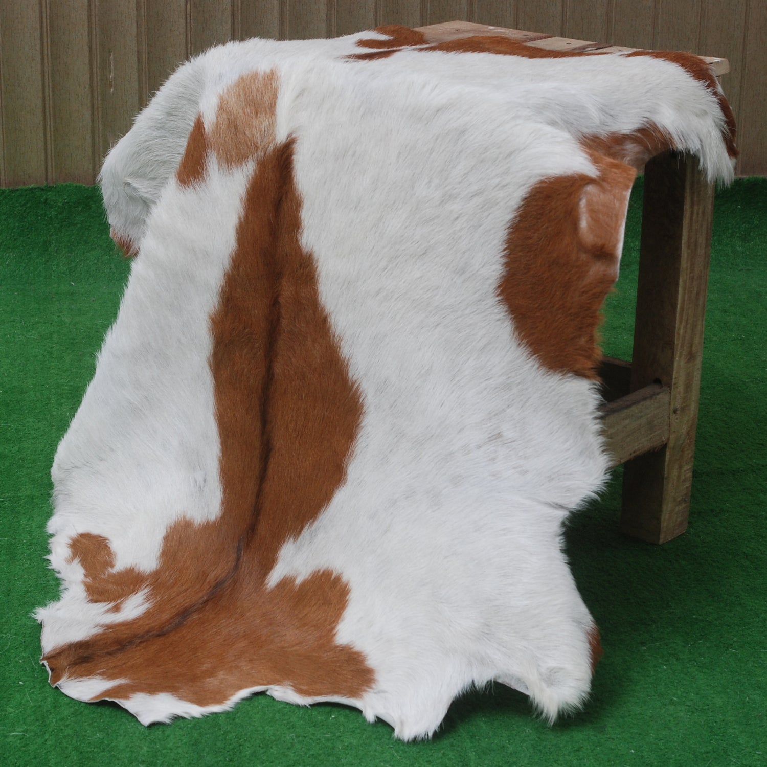 Handcrafted Brown and White Goat Skin Rug - Soft, Durable, and Elegant Décor