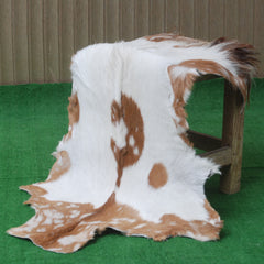 Rustic Brown and White Goat Skin Rug - Unique Pattern for Modern and Classic Décor