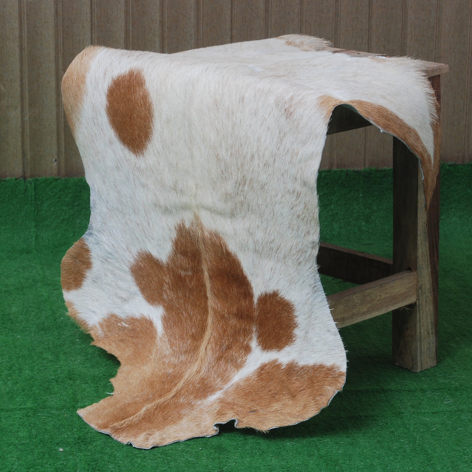 Elegant Brown and White Goat Hide Rug - Perfect Accent for Living Room or Bedroom