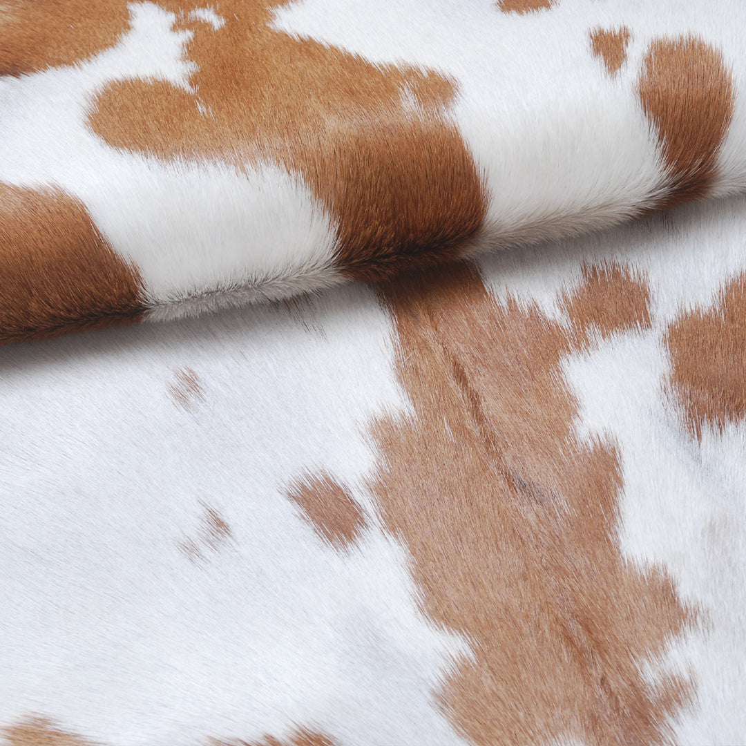 Natural Brown and White Goat Hide Rug - Luxurious Accent for Modern Homes