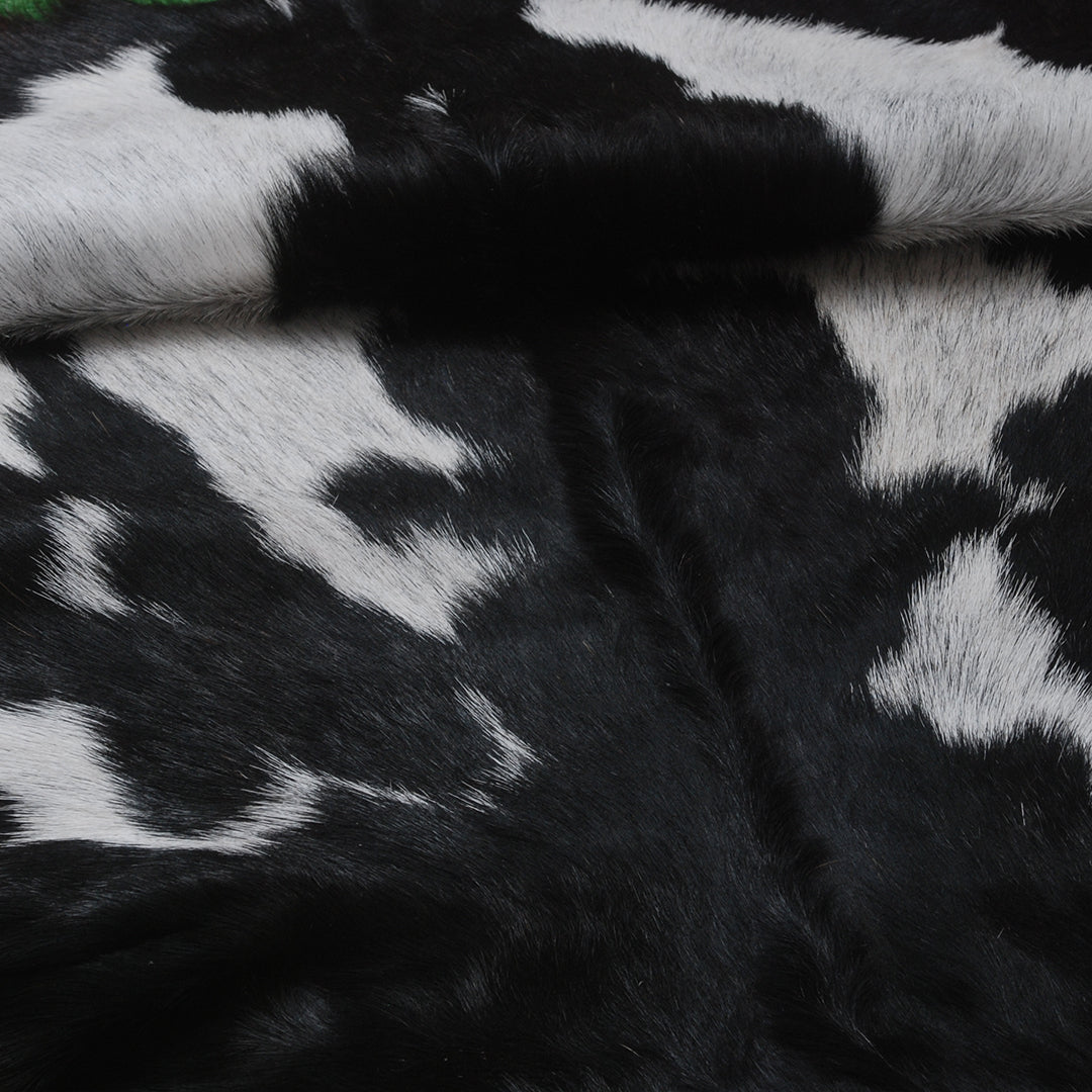 Natural Black and White Goat Hide Rug - Luxurious and Stylish Floor Accent