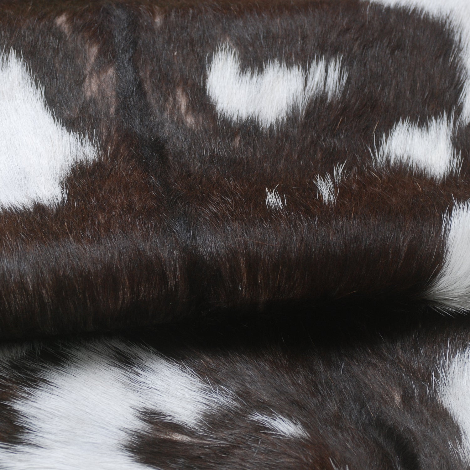 Luxurious Brown and White Goat Hide Rug - Premium Hair-On Rug with Unique Patterns and Non-Slip Suede Back - Sustainable and Eco-Friendly