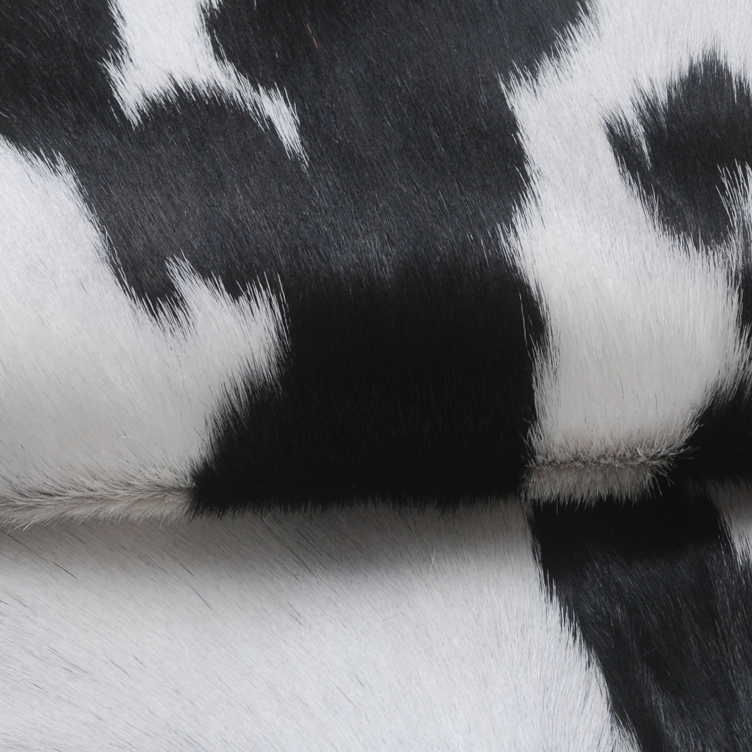 Handcrafted Black and White Goat Skin Rug - Soft and Durable Hair-On Leather